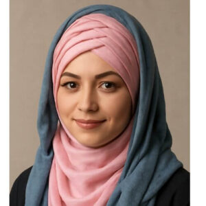 A fashionable and dynamic hijab style where the fabric is layered in a voluminous way, creating folds that add dimension and texture to the overall look.