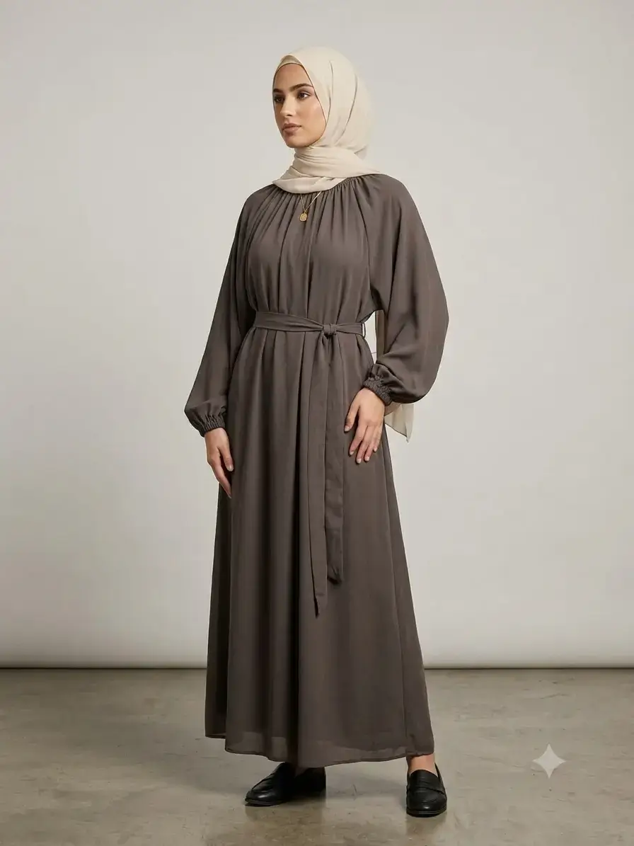 Coffee brown nida abaya side view showing pleated neckline and waist belt tie