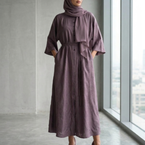 Dusty mauve embossed nida abaya styled with matching hijab, kimono sleeves, and waist belt