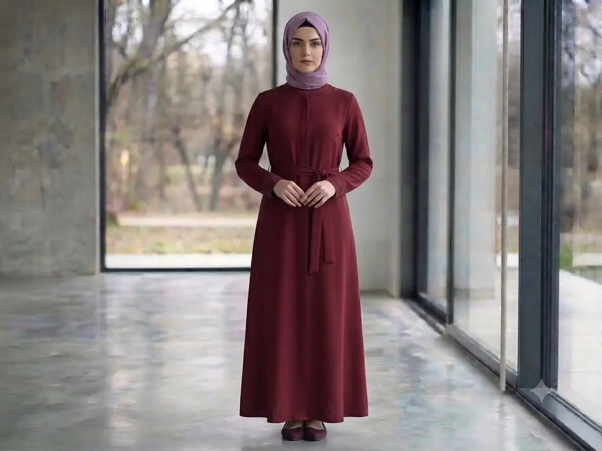 Deep maroon nida abaya with collar closure, waist belt, and relaxed A-line silhouette