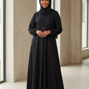 Jet black crinkle nida abaya with front button and tassel detail, elastic cuff sleeves, and side pockets, styled with matching hijab